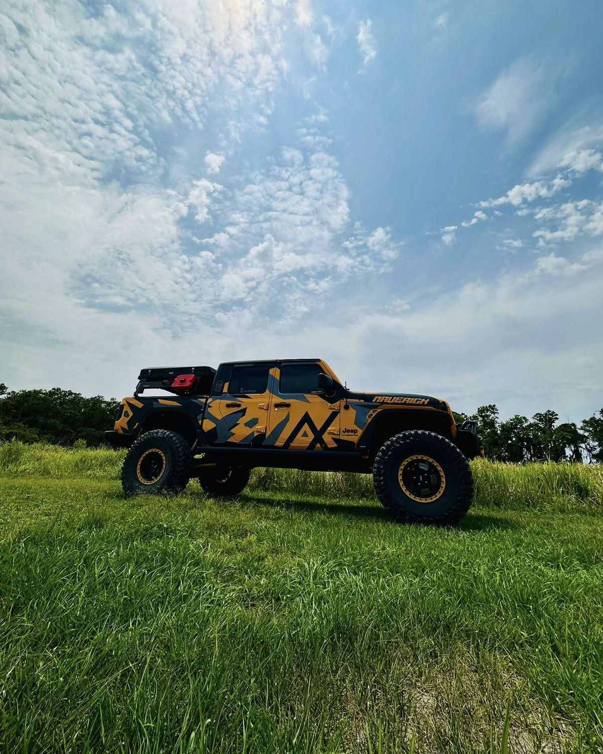 Lifted Jeep Gladiator with a custom wrap