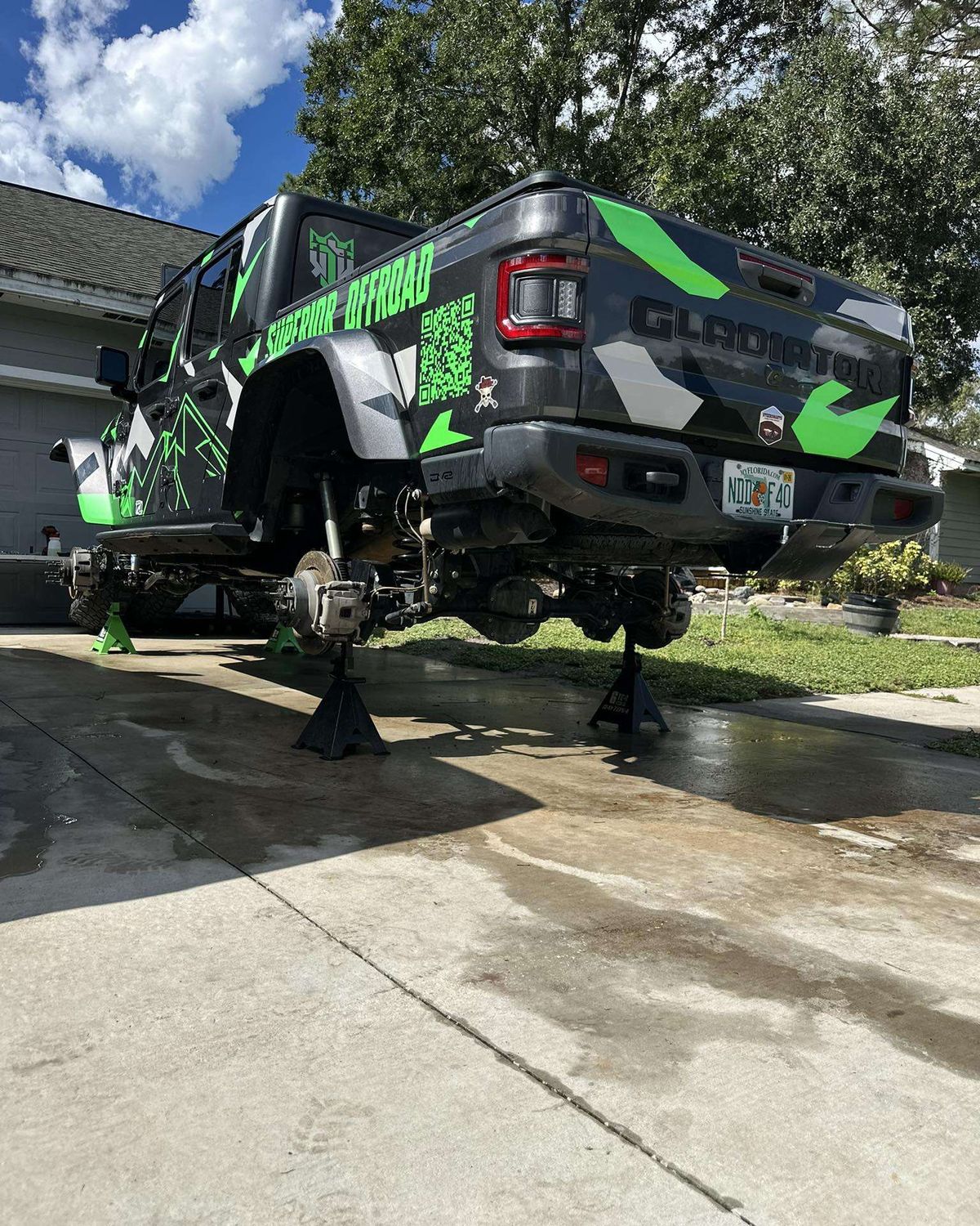 Superior Auto & Offroad’s wrapped Jeep Gladiator on jack stands